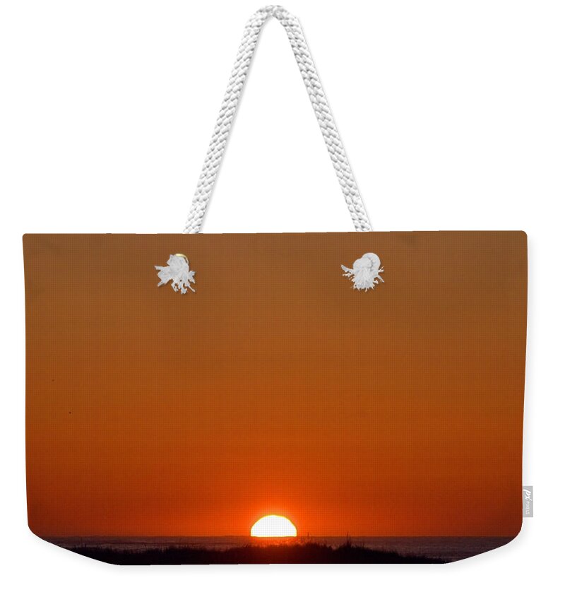 Seas Weekender Tote Bag featuring the photograph True Sunrise by Newwwman