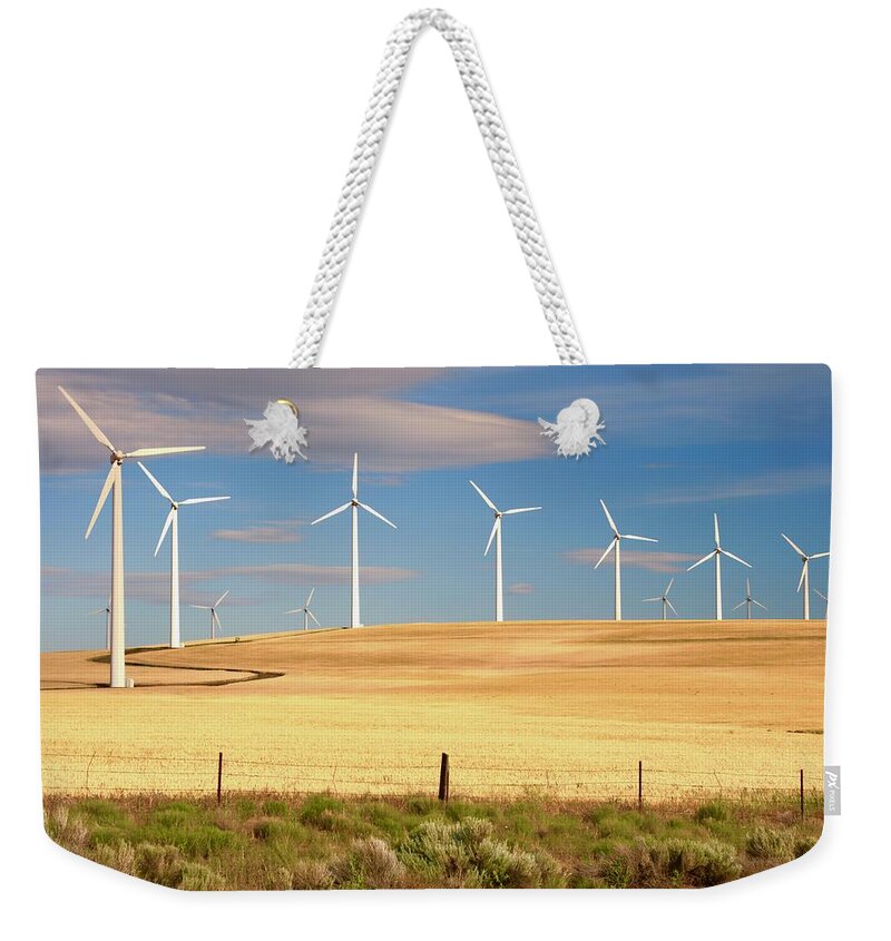 Wind Weekender Tote Bag featuring the photograph Turbine Line by Todd Kreuter