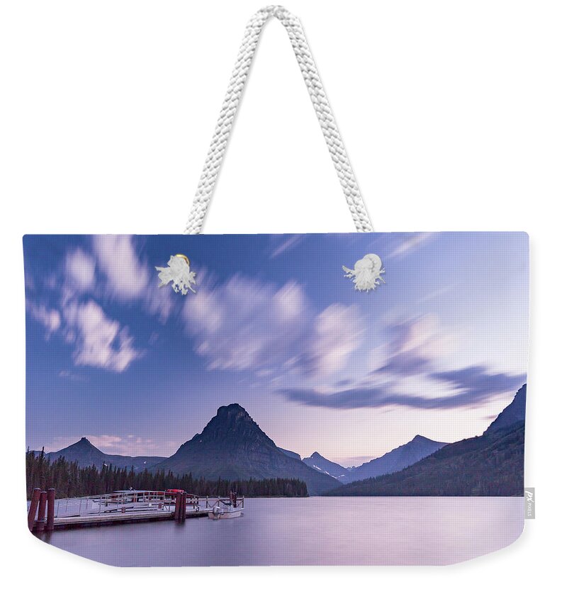 Clements Mountain Weekender Tote Bag featuring the photograph two medicine lake, MT 1 by Mati Krimerman