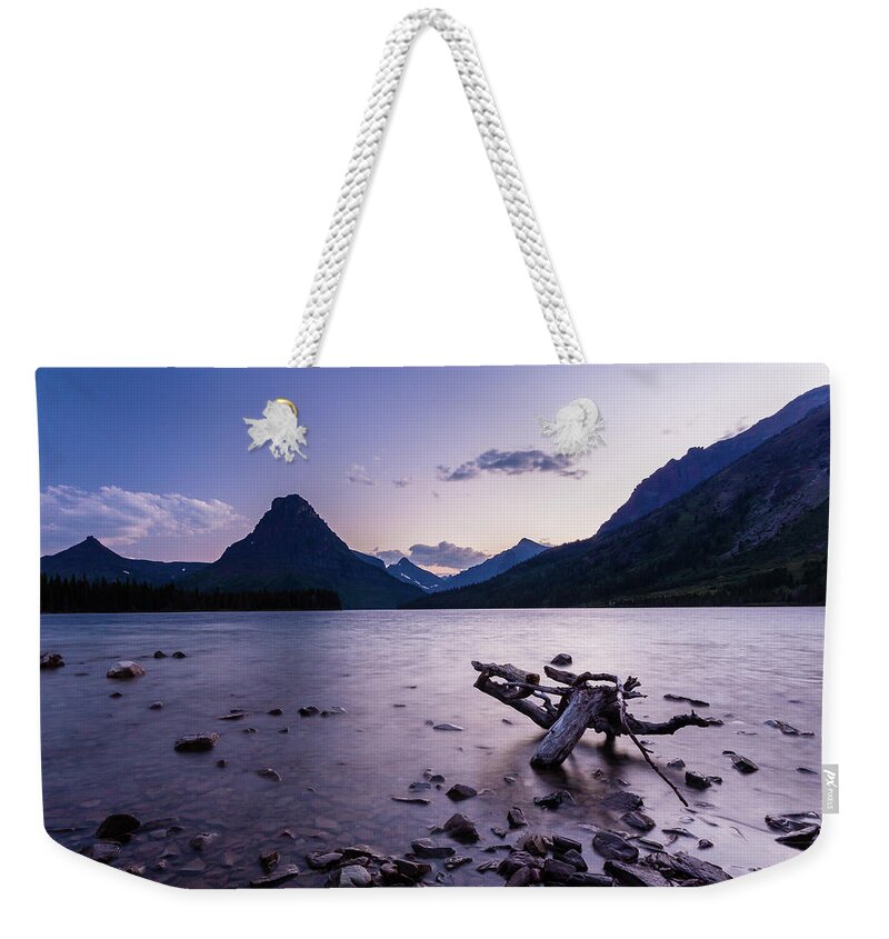 Clements Mountain Weekender Tote Bag featuring the photograph two medicine lake, MT 2 by Mati Krimerman
