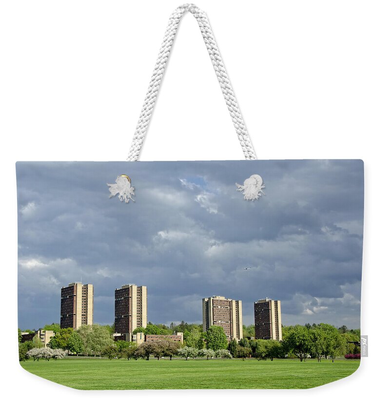 Amherst Weekender Tote Bag featuring the photograph UMass Southwest Towers by Donna Doherty