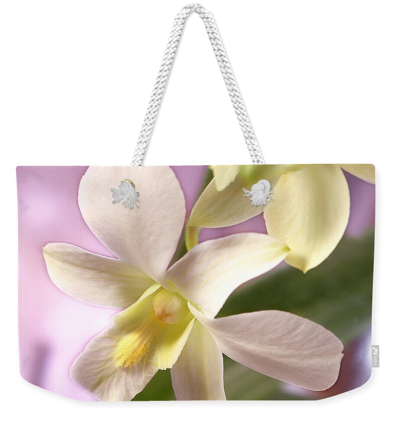 White Flower Weekender Tote Bag featuring the photograph Unique White Orchid by Mike McGlothlen