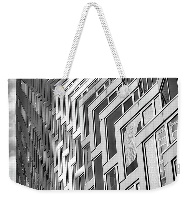 625 West 57th Street Weekender Tote Bag featuring the photograph Upward View to West 57 ST NYC BW by Susan Candelario