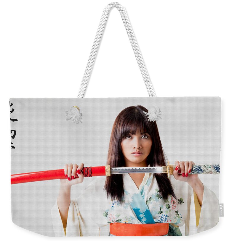 Models Weekender Tote Bag featuring the photograph Vengeful Innocence by Rikk Flohr