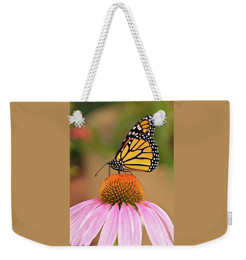 Animal Weekender Tote Bag featuring the photograph Monarch Butterfly on a Purple Coneflower by Jeff Goulden