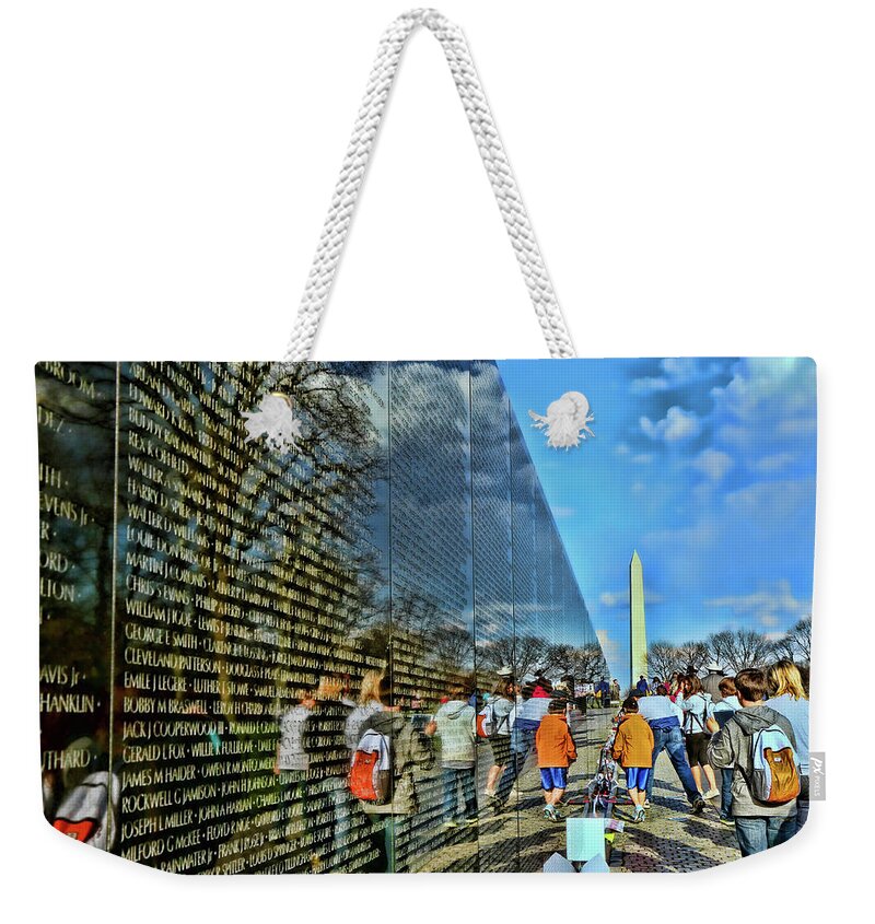 America Weekender Tote Bag featuring the photograph Vietnam Veterans Memorial and Washington Monument by Allen Beatty