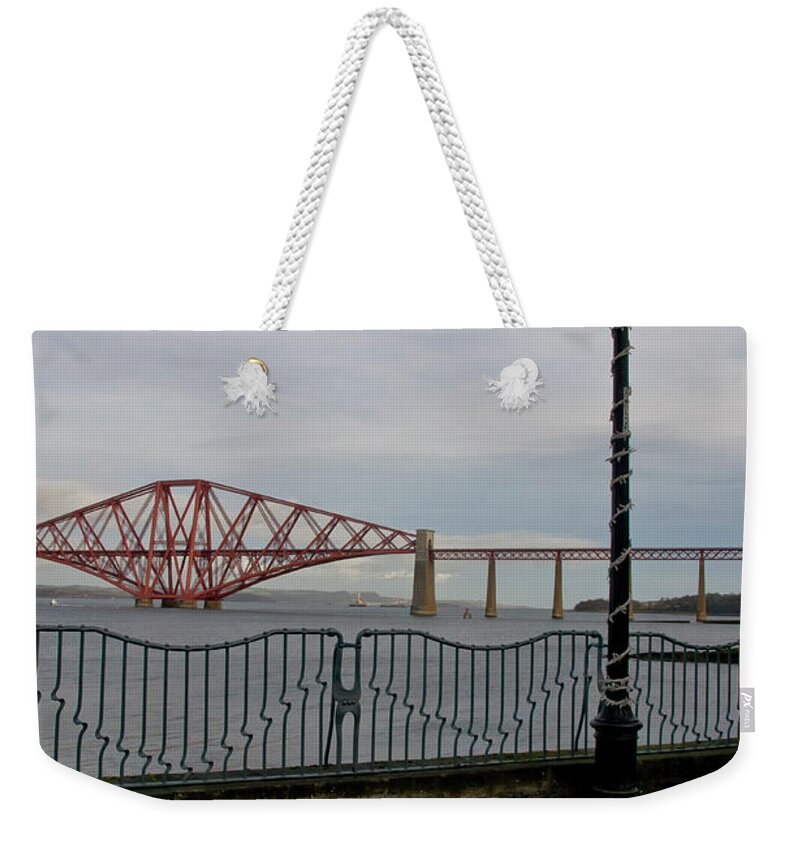 Forth Rail Bridge Weekender Tote Bag featuring the photograph View at the Forth rail bridge from High Street in South Queensferry by Elena Perelman