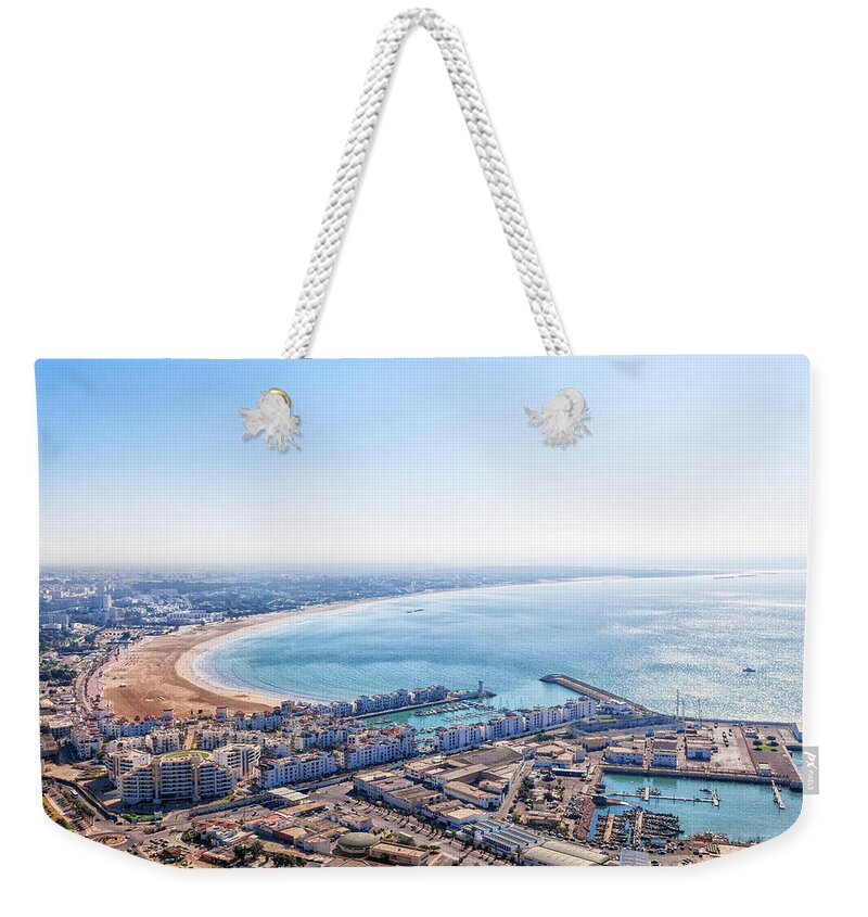 Africa Weekender Tote Bag featuring the photograph View from the mountain with the old kasbah to the bay of Agadir by Gina Koch