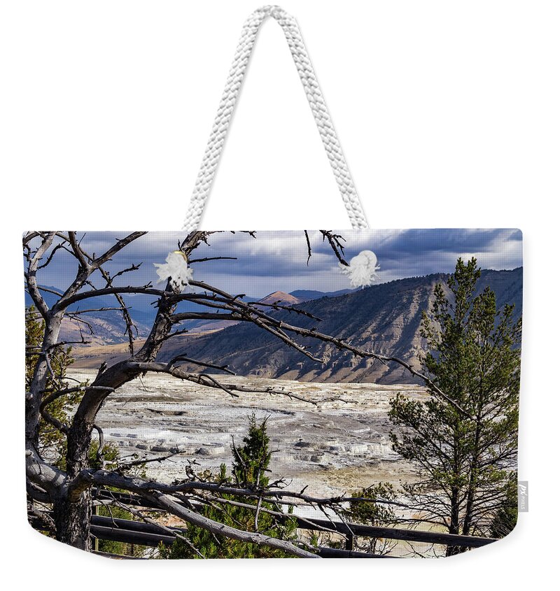 America Weekender Tote Bag featuring the photograph View of the travertine and mountains from the pathway at Mammoth Hot Springs by Roslyn Wilkins