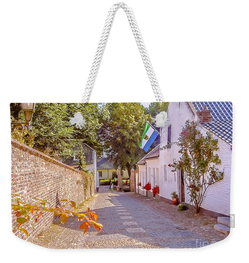 Rural Weekender Tote Bag featuring the photograph Village street in Holland 1 by Claudia M Photography
