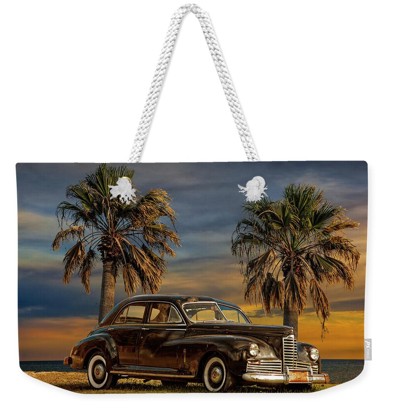 Auto Weekender Tote Bag featuring the photograph Vintage Classic Automobile with Palm Trees at Sunrise by Randall Nyhof