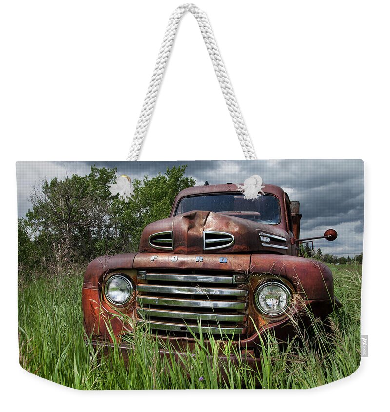 Rusty Trucks Weekender Tote Bag featuring the photograph Vintage Ford Truck by Theresa Tahara