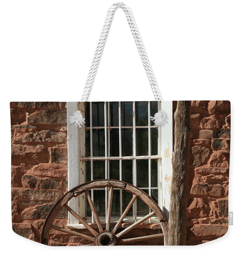 Wheel Weekender Tote Bag featuring the photograph Wagon Wheel by Timothy Johnson