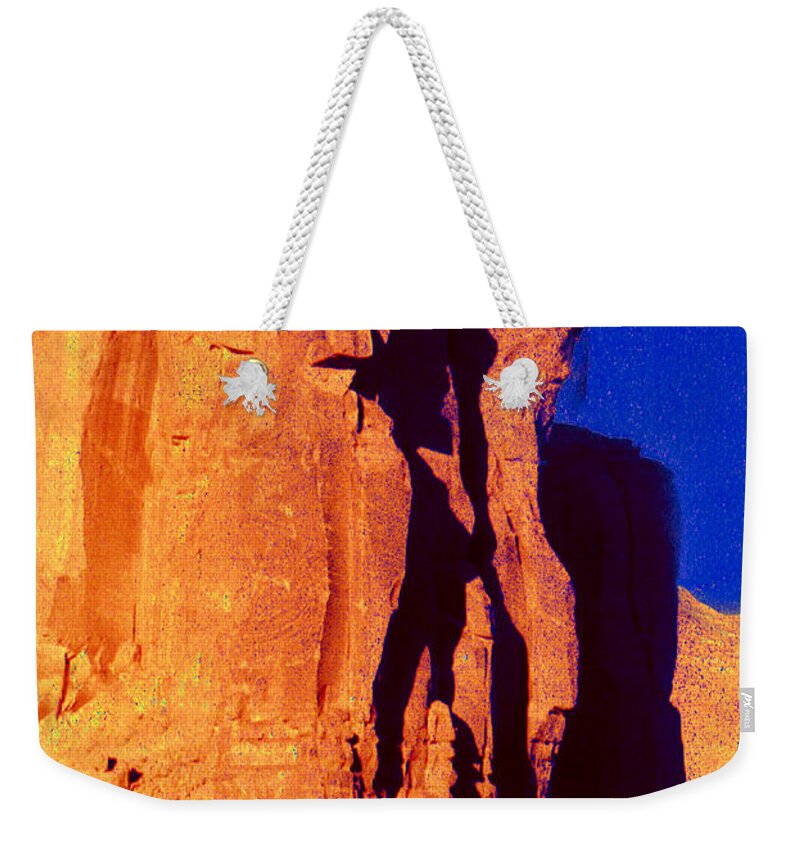 Southwest Landscape Weekender Tote Bag featuring the photograph Warrior in the Rock in Monument Valley by Joe Hoover