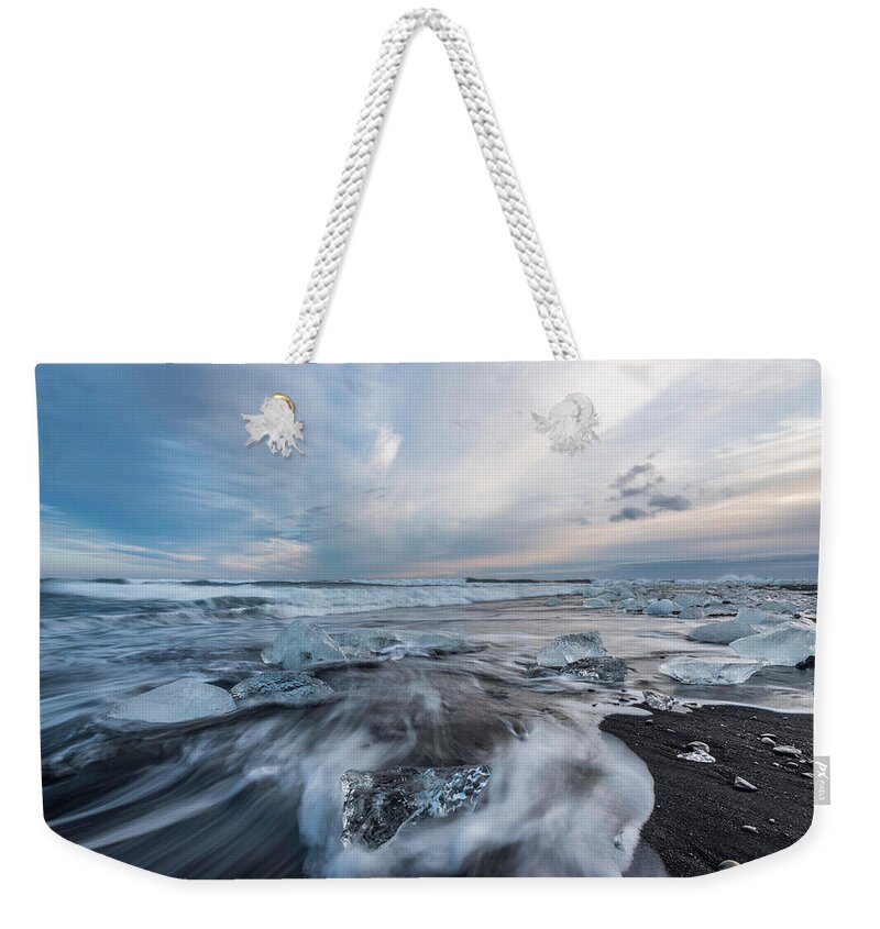  Weekender Tote Bag featuring the photograph Washed up Ice Sunset by Scott Cunningham