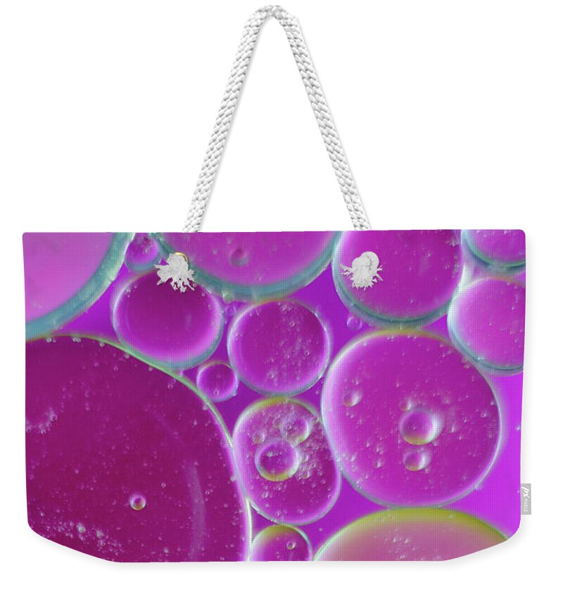 Water Weekender Tote Bag featuring the photograph Water and oil bubbles by Andy Myatt