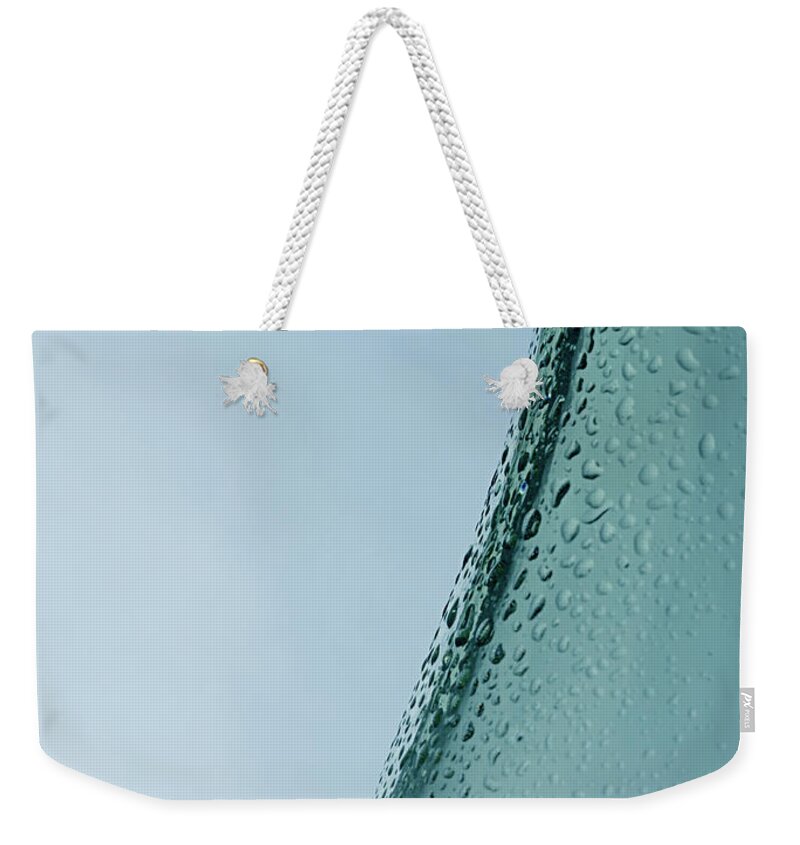 Wine Weekender Tote Bag featuring the photograph Water dropslets on a bottle by Andreas Berheide