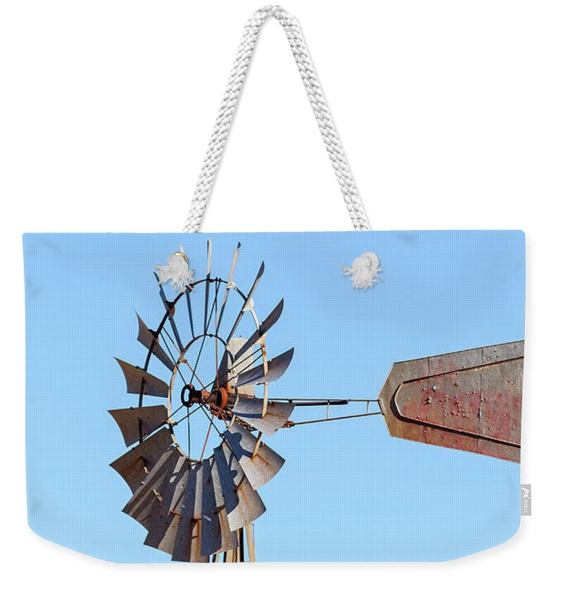 Water Pump Windmill on Blue Sky Background Weekender Tote Bag by David Gn -  Pixels