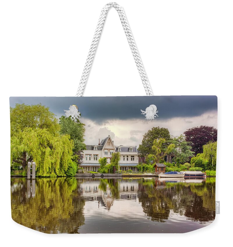 Netherlands Weekender Tote Bag featuring the photograph Water Reflections by Nadia Sanowar