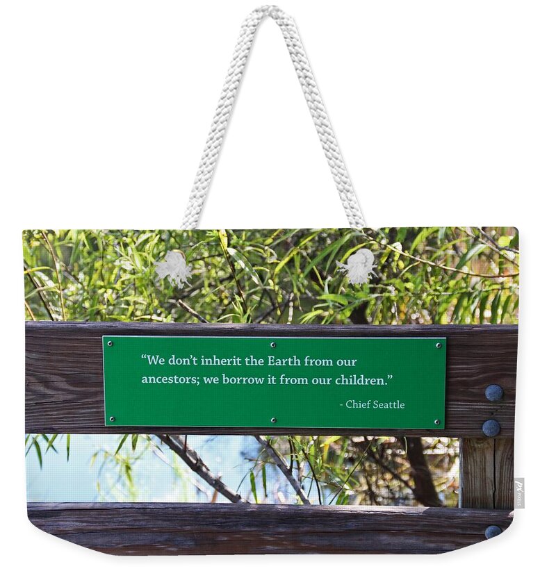 We Don't Inherit The Earth Weekender Tote Bag featuring the photograph We Don't Inherit the Earth by Michiale Schneider