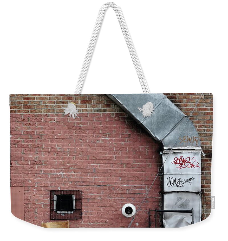 Urban Weekender Tote Bag featuring the photograph Where He Smokes by Kreddible Trout