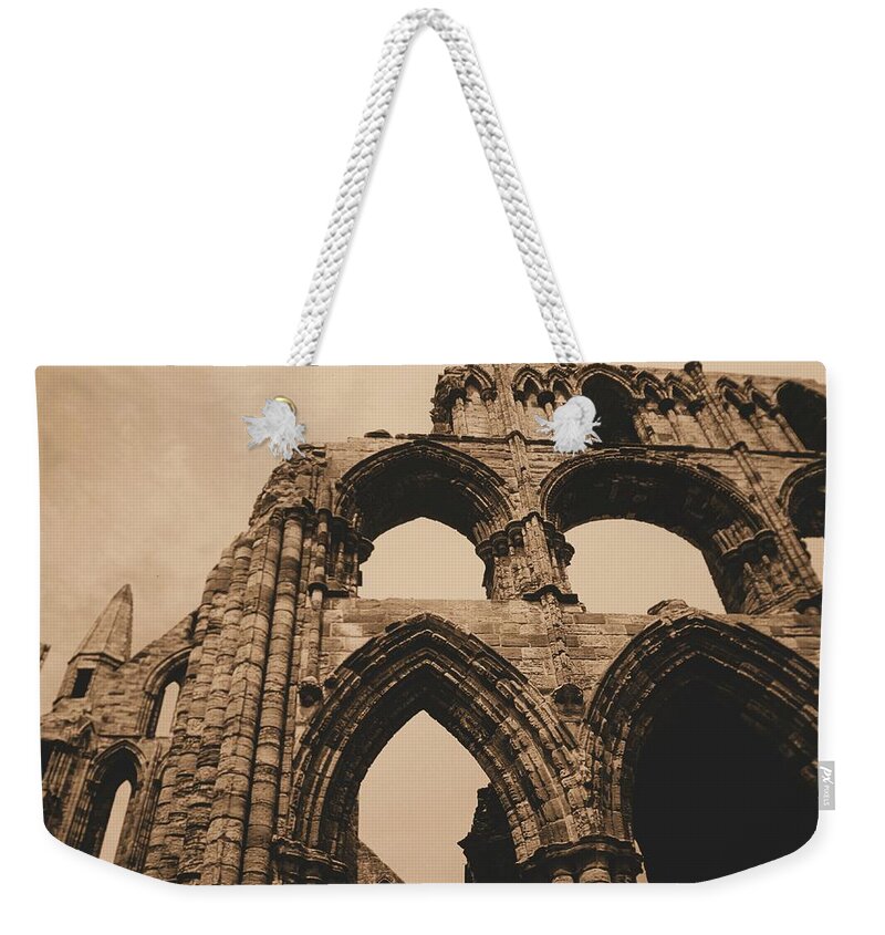 Whitby Abbey England Sepia Old Medieval Middle Ages Church Monastery Nun Nuns Architecture York Yorkshire Monasteries Ruins Saint Century Black Death Building  Cathedral Cloister Feudal Benedictine Monk Monks Celtic Bram Stoker Dracula Weekender Tote Bag featuring the photograph Whitby Abbey #73 by Raymond Magnani