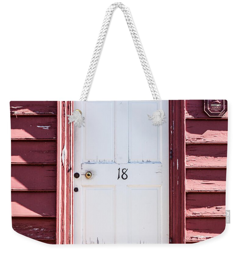 Annapolis Weekender Tote Bag featuring the photograph White Door and Peach Wall by Thomas Marchessault