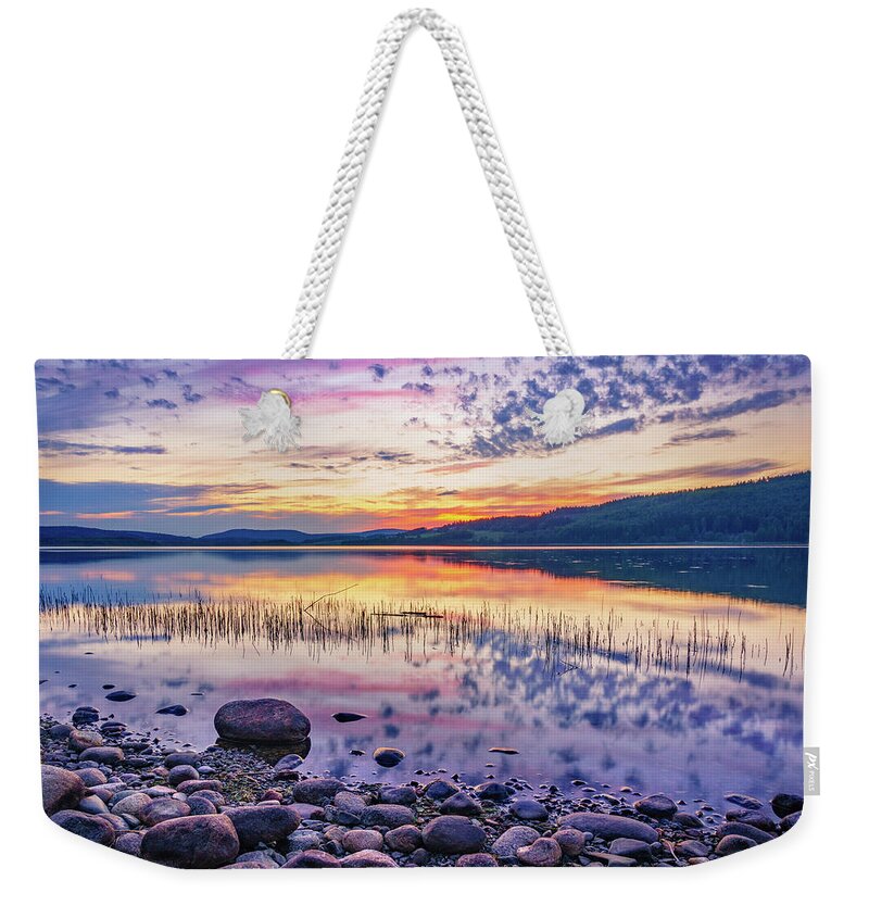 Europe Weekender Tote Bag featuring the photograph White night sunset on a Swedish lake by Dmytro Korol