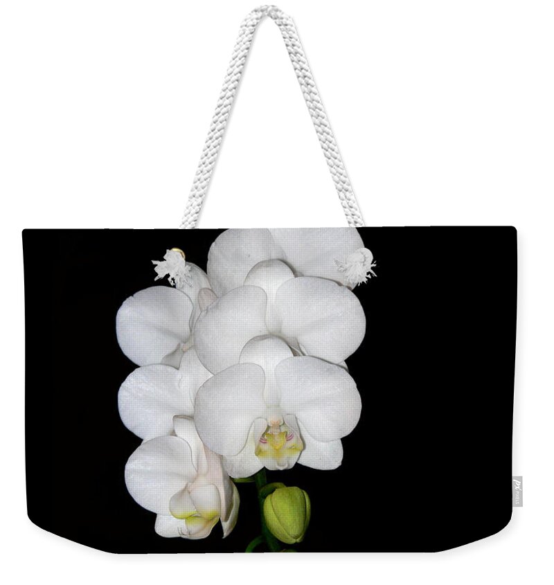 White Weekender Tote Bag featuring the photograph White Orchids on Black by Michele A Loftus