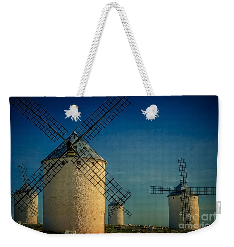Windmills Weekender Tote Bag featuring the photograph Windmills under blue sky by Heiko Koehrer-Wagner