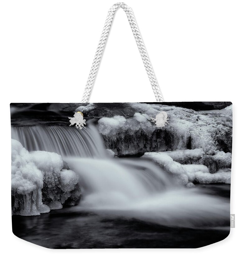 Stickney Brook Weekender Tote Bag featuring the photograph Winter Brook In Black and White by Tom Singleton