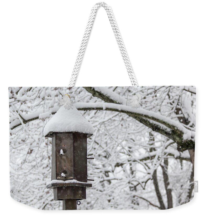 2018 Weekender Tote Bag featuring the photograph Winter in Spring Bird Feeder by Teresa Mucha