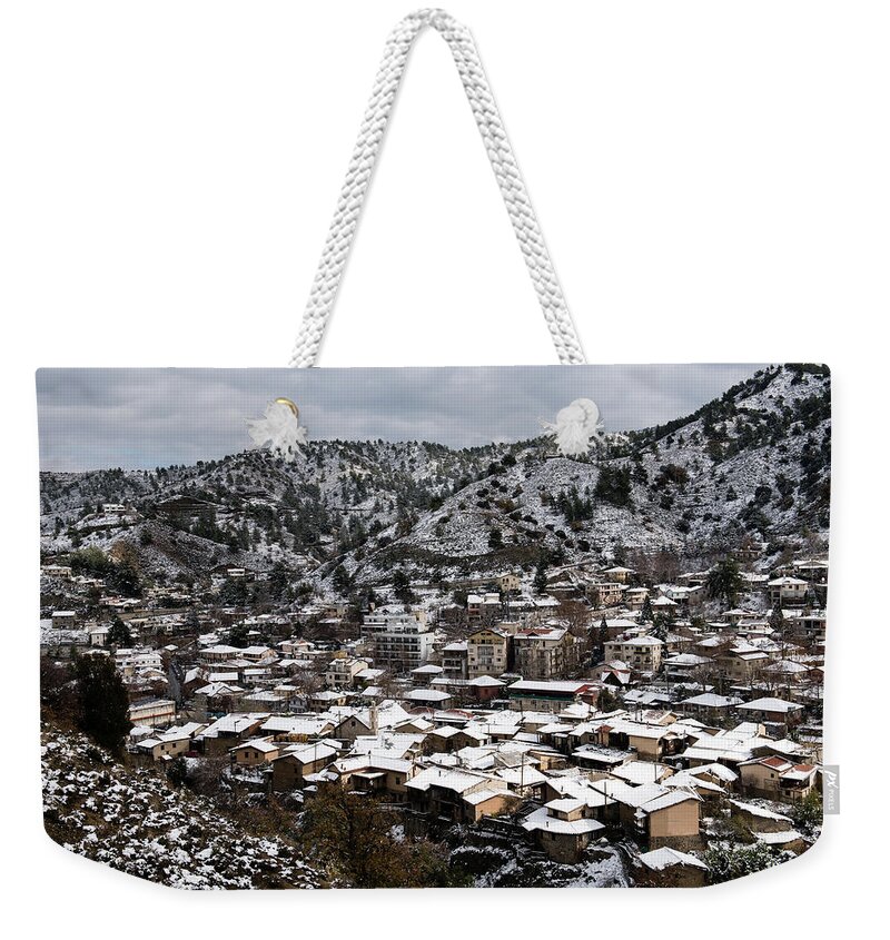 Winter Weekender Tote Bag featuring the photograph Winter mountain village landscape with snow by Michalakis Ppalis