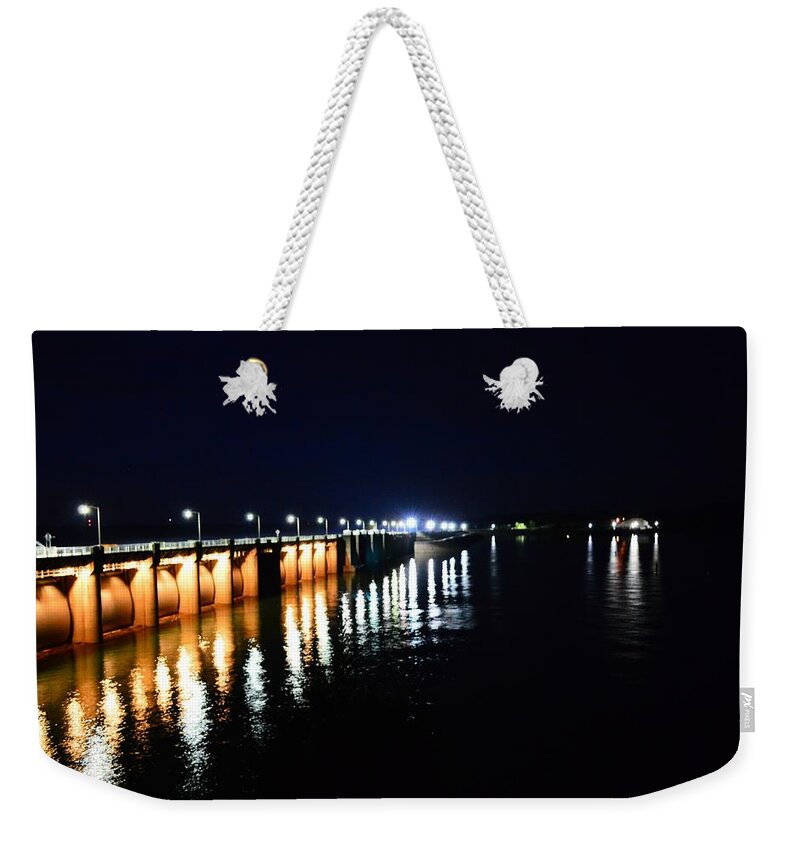 Nighttime Weekender Tote Bag featuring the photograph Wolf Creek Dam Nightlights Reflection by Stacie Siemsen