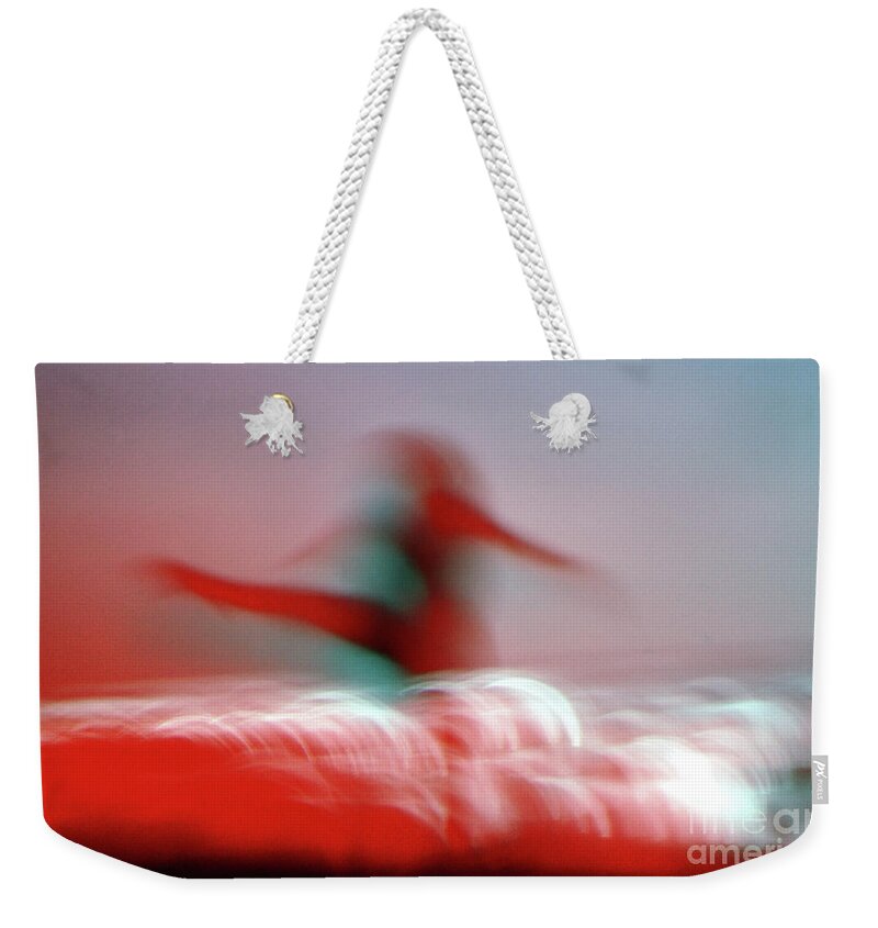 Female Weekender Tote Bag featuring the photograph Woman Dancing in Flying Stance by Wernher Krutein