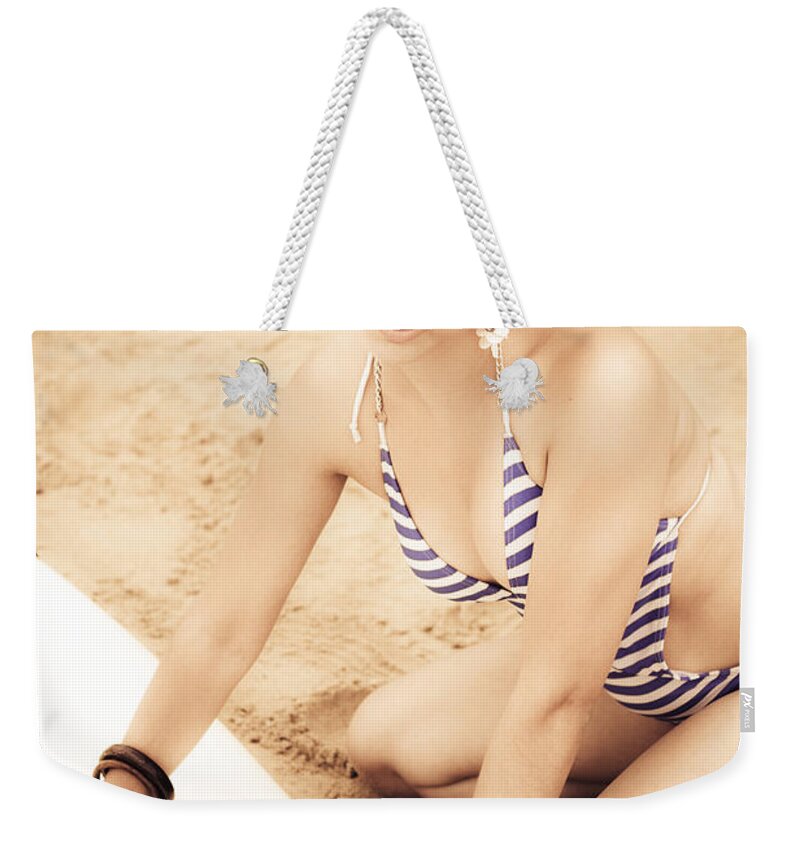 Surf Weekender Tote Bag featuring the photograph Woman Waxing Surfboard by Jorgo Photography