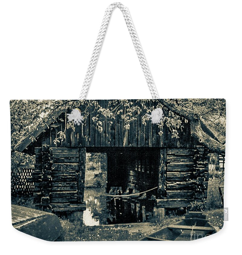 Mona Stut Weekender Tote Bag featuring the digital art Wooden Boats House Reflections BW by Mona Stut