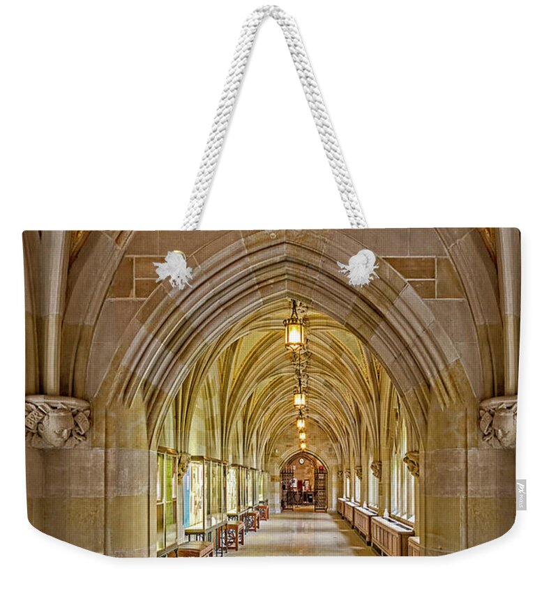 Yale University Weekender Tote Bag featuring the photograph Yale University Cloister Hallway by Susan Candelario