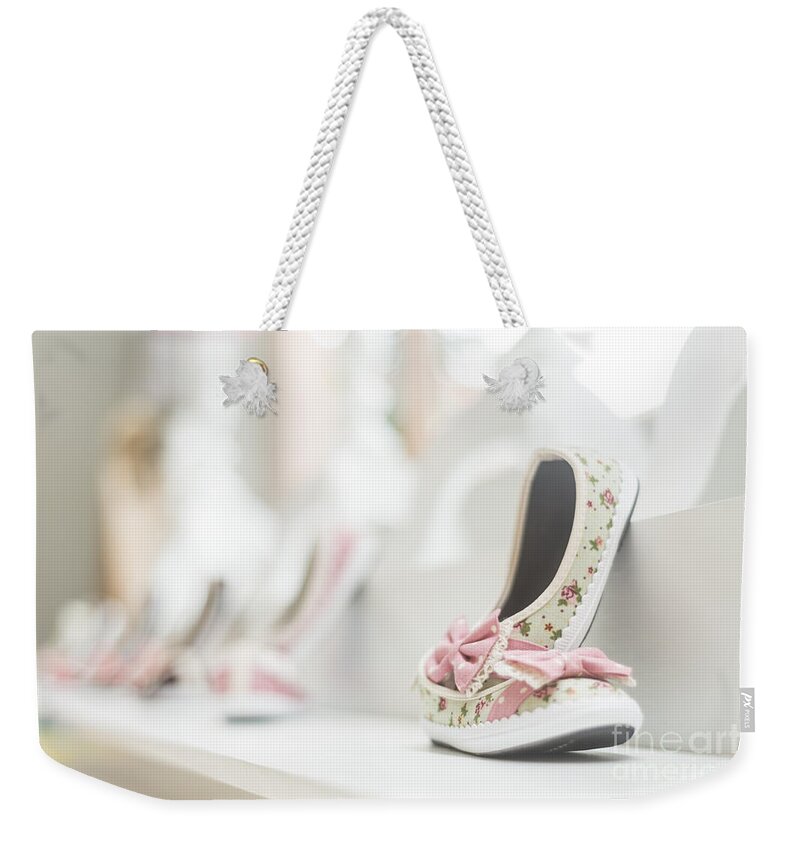 Baby Weekender Tote Bag featuring the photograph Young Girl Shoes In Children Footwear Shop by JM Travel Photography