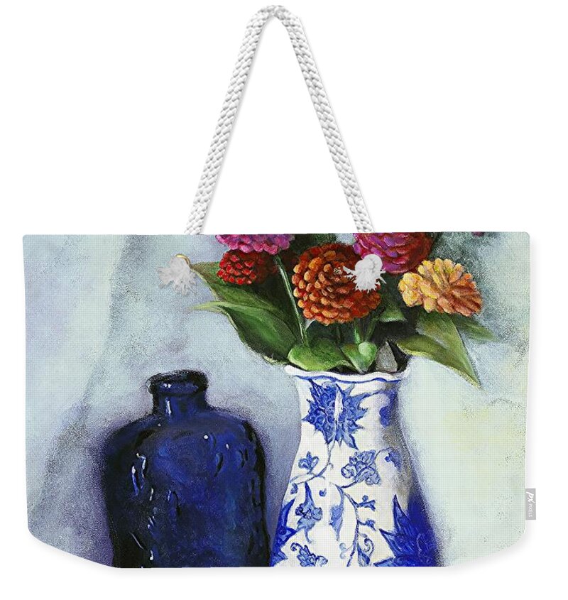 Still Life Weekender Tote Bag featuring the painting Zinnias with Blue Bottle by Marlene Book