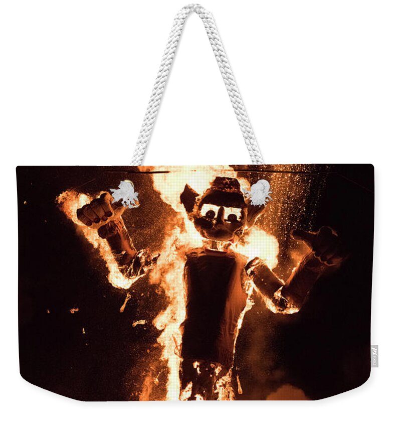 Natanson Weekender Tote Bag featuring the photograph Zozobra Backlit by Steven Natanson