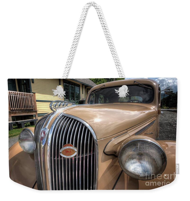 1938 Plymouth Weekender Tote Bag featuring the photograph 1938 Plymouth by Arttography LLC