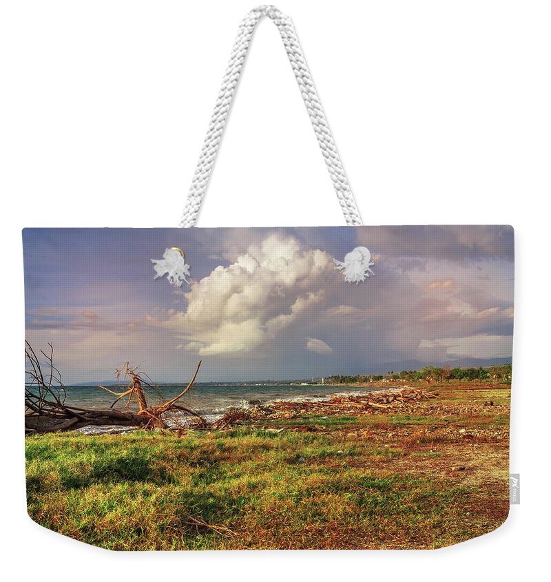 Sunset Weekender Tote Bag featuring the photograph a beautiful afternoon on Kampung Nelayan beach #1 by Mangge Totok