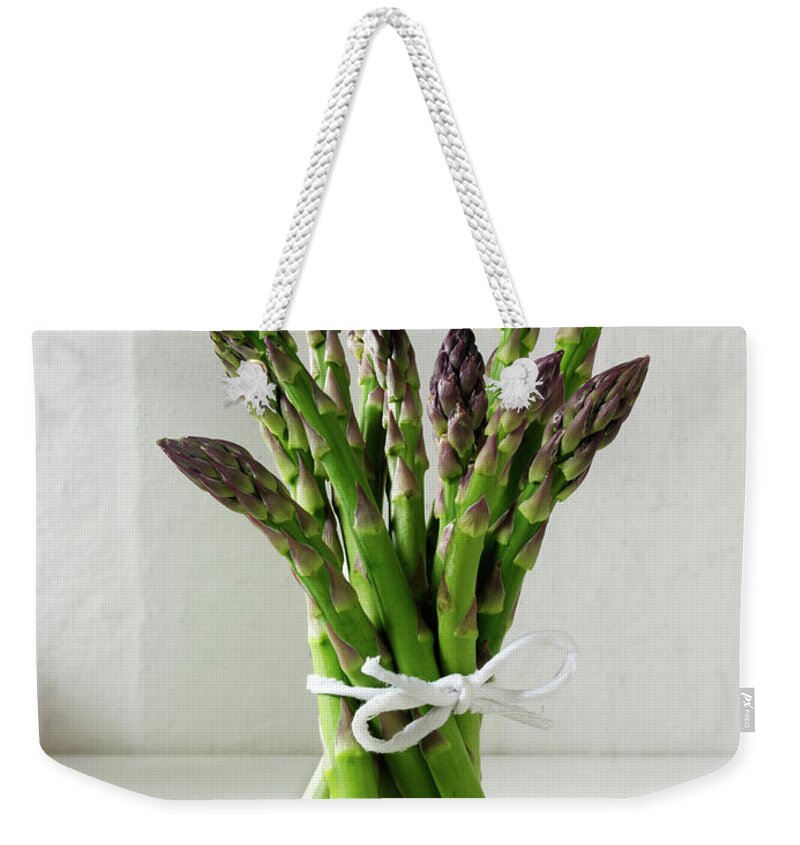 Bunch Weekender Tote Bag featuring the photograph Bunch Of Fresh English Asparagus Spears #1 by Paul Williams - Funkystock