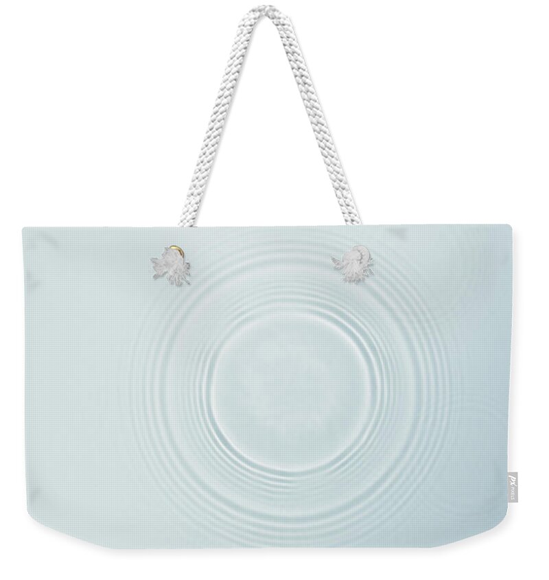 Purity Weekender Tote Bag featuring the photograph Circle Ripples On Water Surface #1 by Paul Taylor