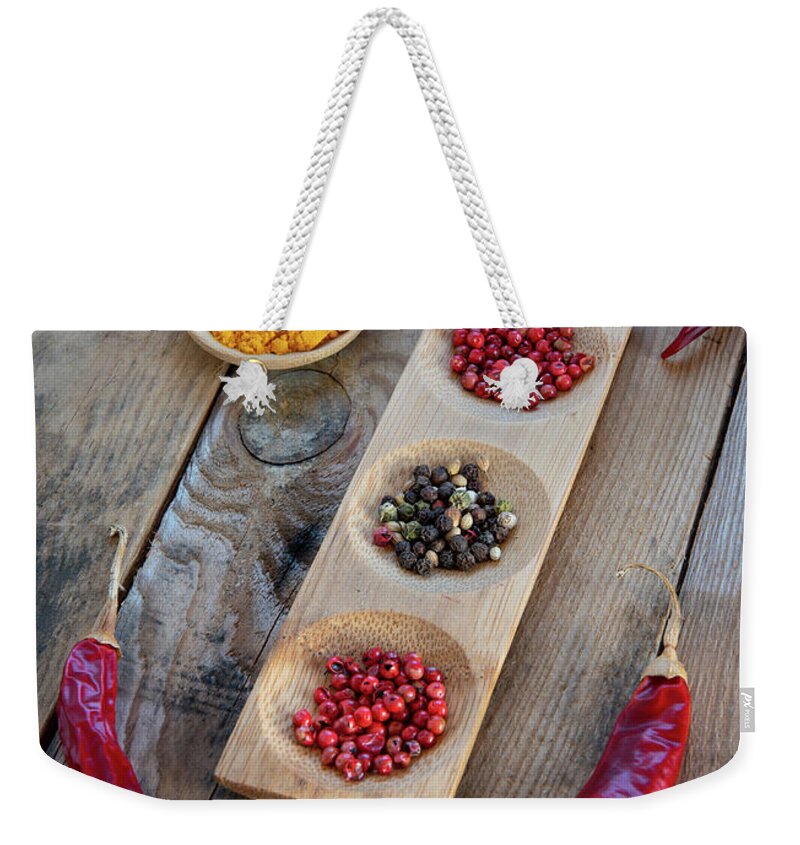 Spice Weekender Tote Bag featuring the photograph Collection of aromatic herbal peeper spices by Michalakis Ppalis
