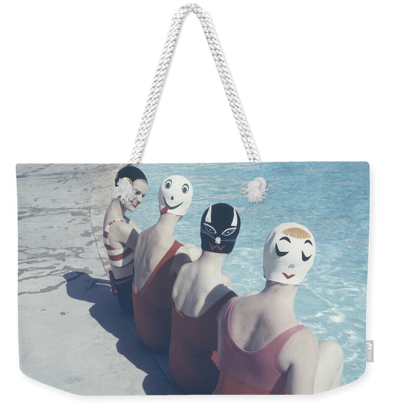 Swim Caps Weekender Tote Bag featuring the photograph 'Crazy' Swim Caps by Ralph Crane
