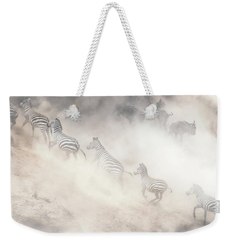 Wildlife Weekender Tote Bag featuring the photograph Dramatic Dusty Great Migration in Kenya by Good Focused