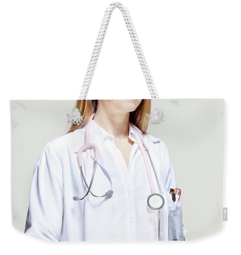 People Weekender Tote Bag featuring the photograph Female Doctor #1 by James Whitaker