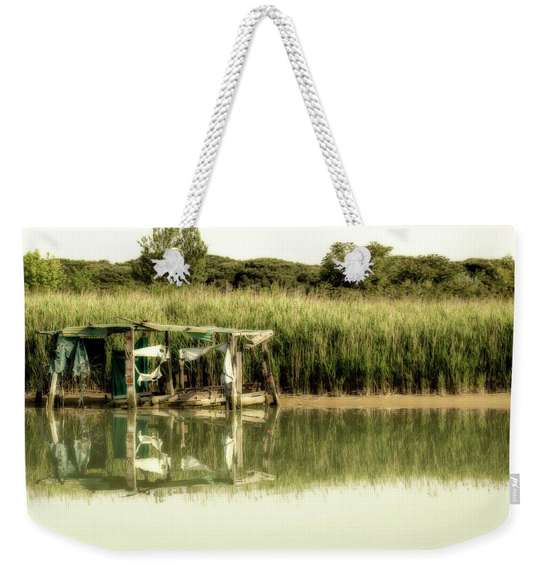 Shack Weekender Tote Bag featuring the photograph Fishing shack on sea channel #1 by Vivida Photo PC